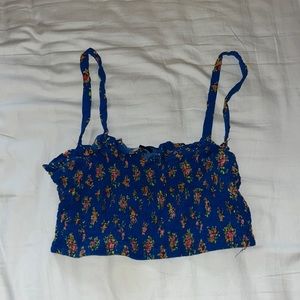 Size S, elastic material, dark blue w/flower pattern.